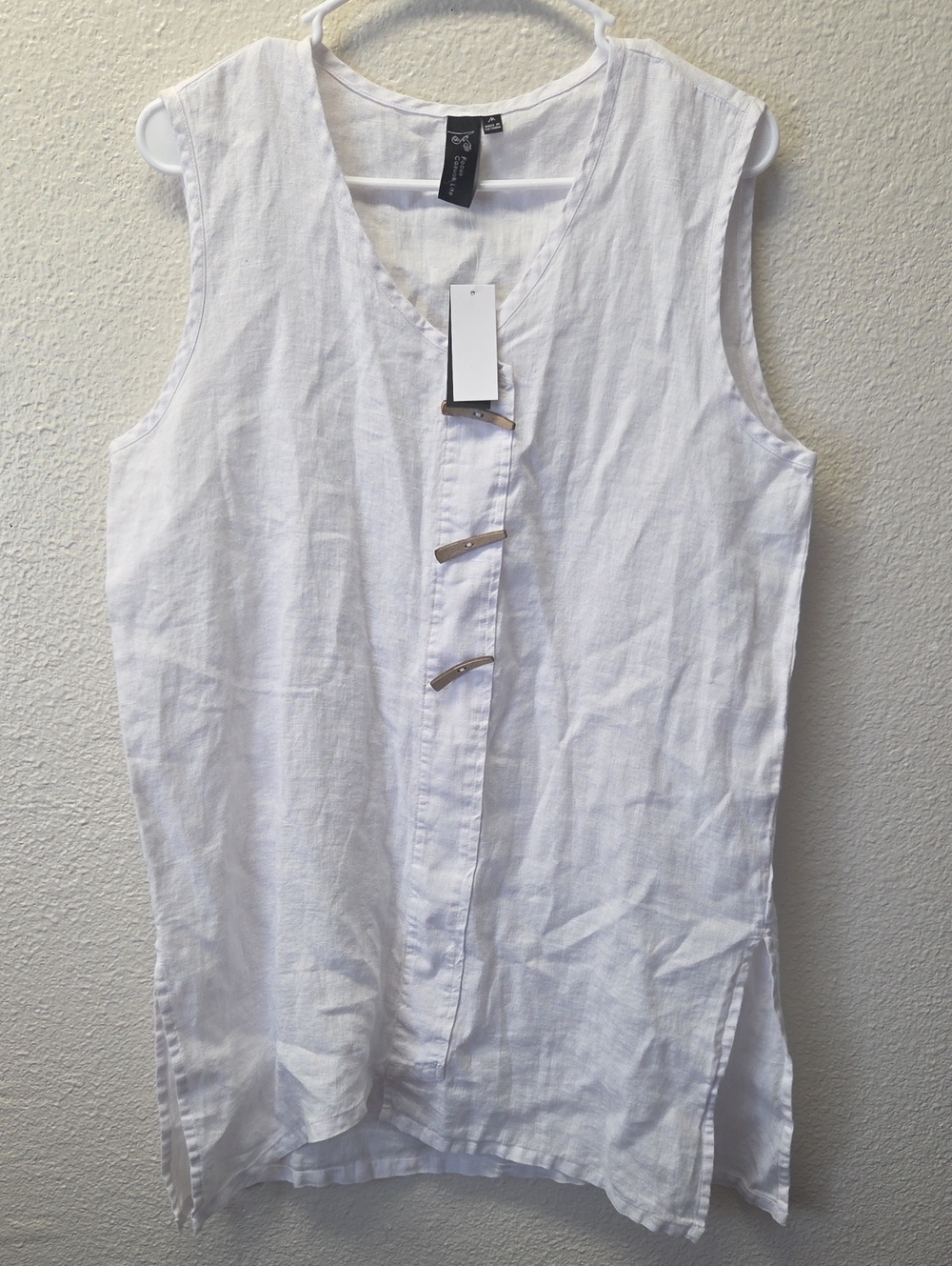 Sleeveless White Linen Tunic with Decorative Metal Closures